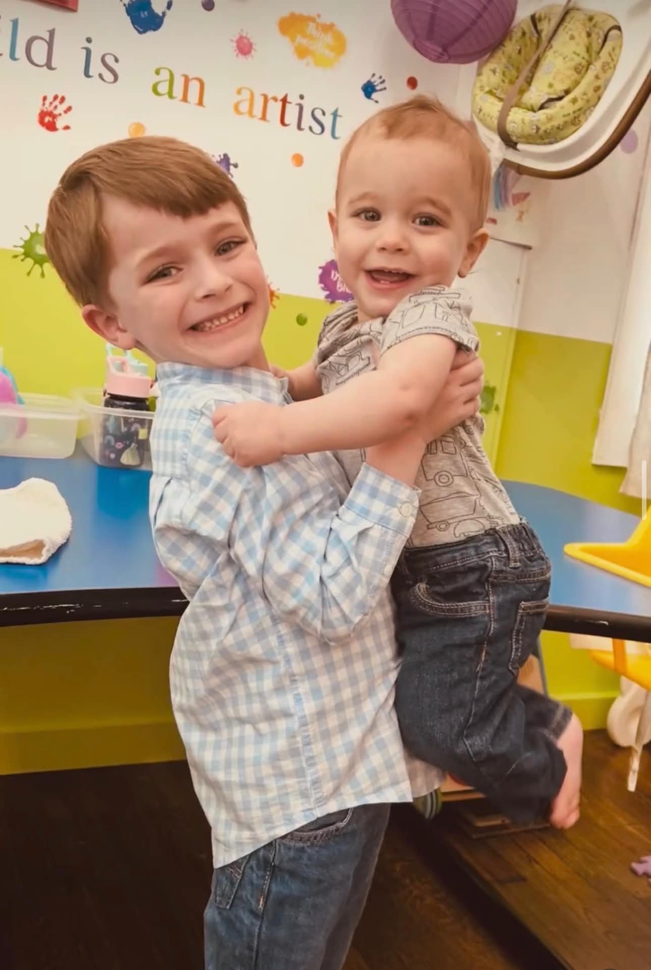 Kids smiling at the table