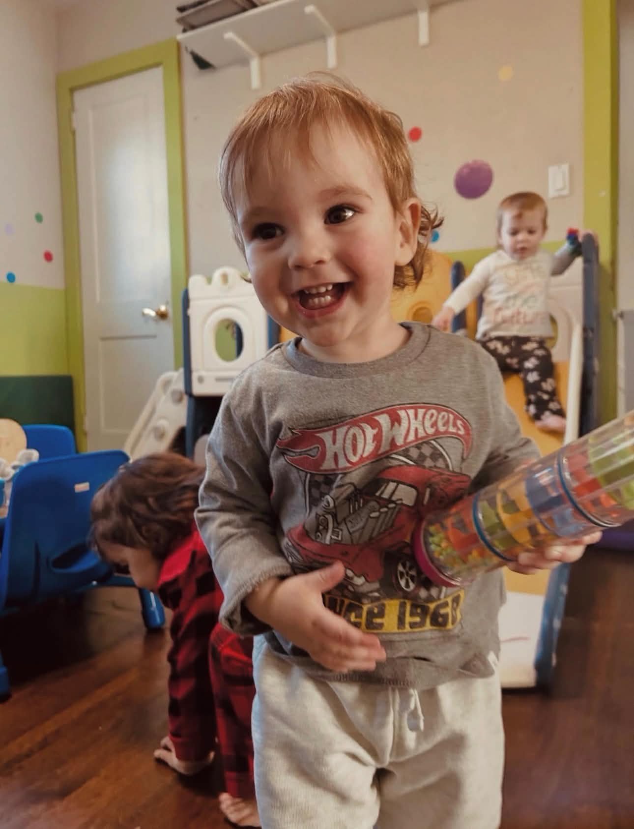 Two girls laughing with puzzles