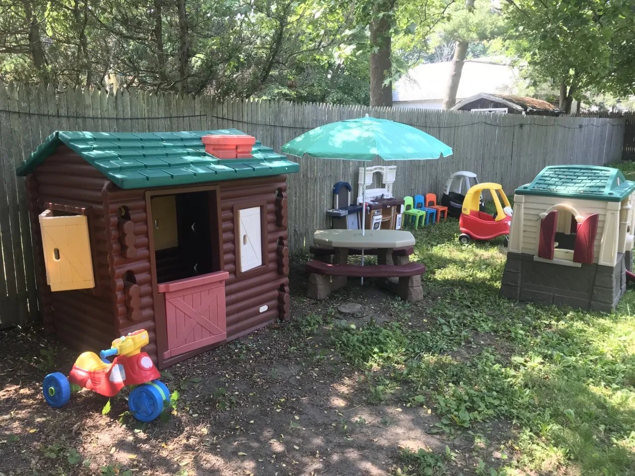 Bright play area with reading bench and train rug